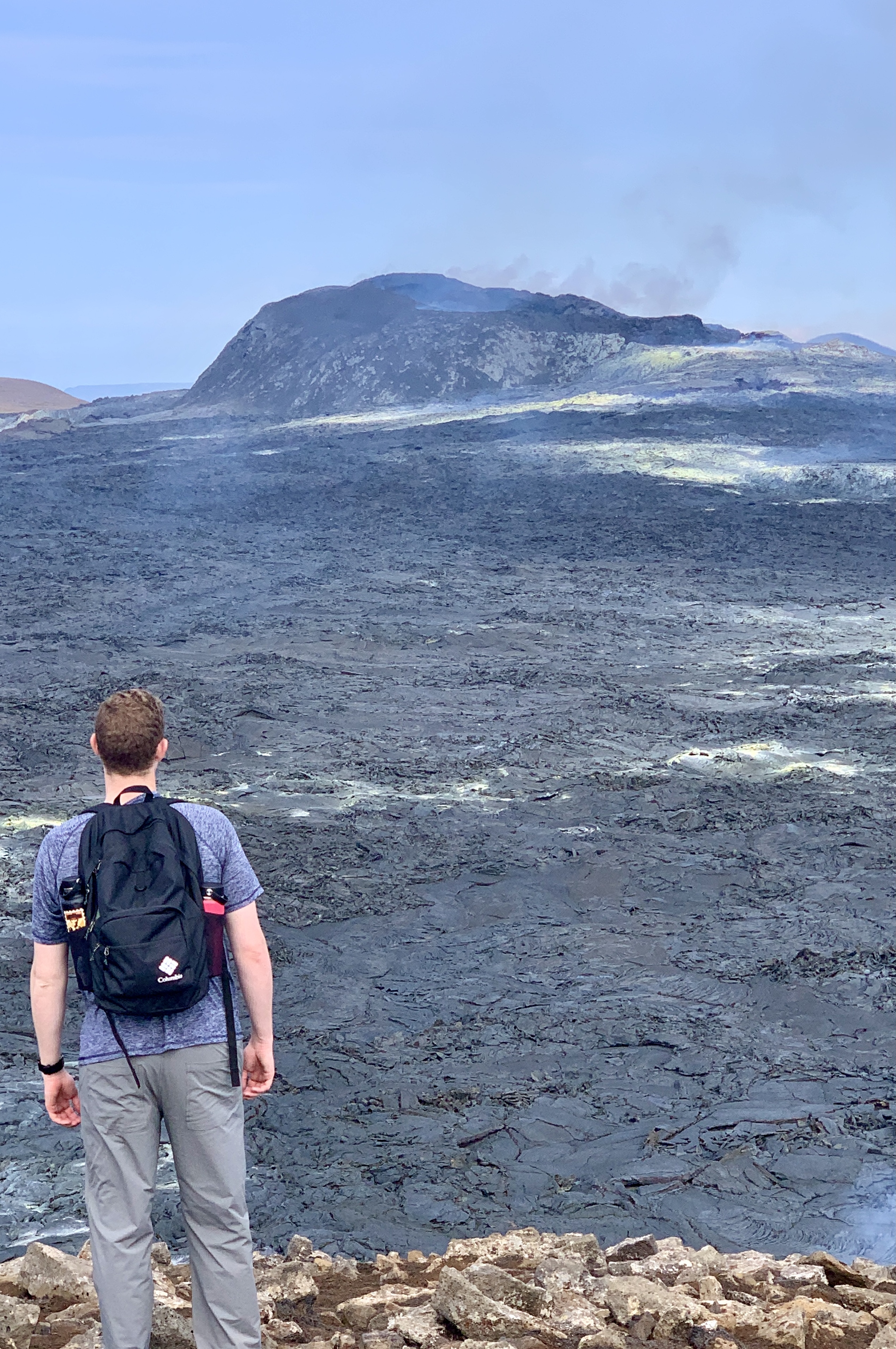 Mark looking out at the smoking crater & fresh lava