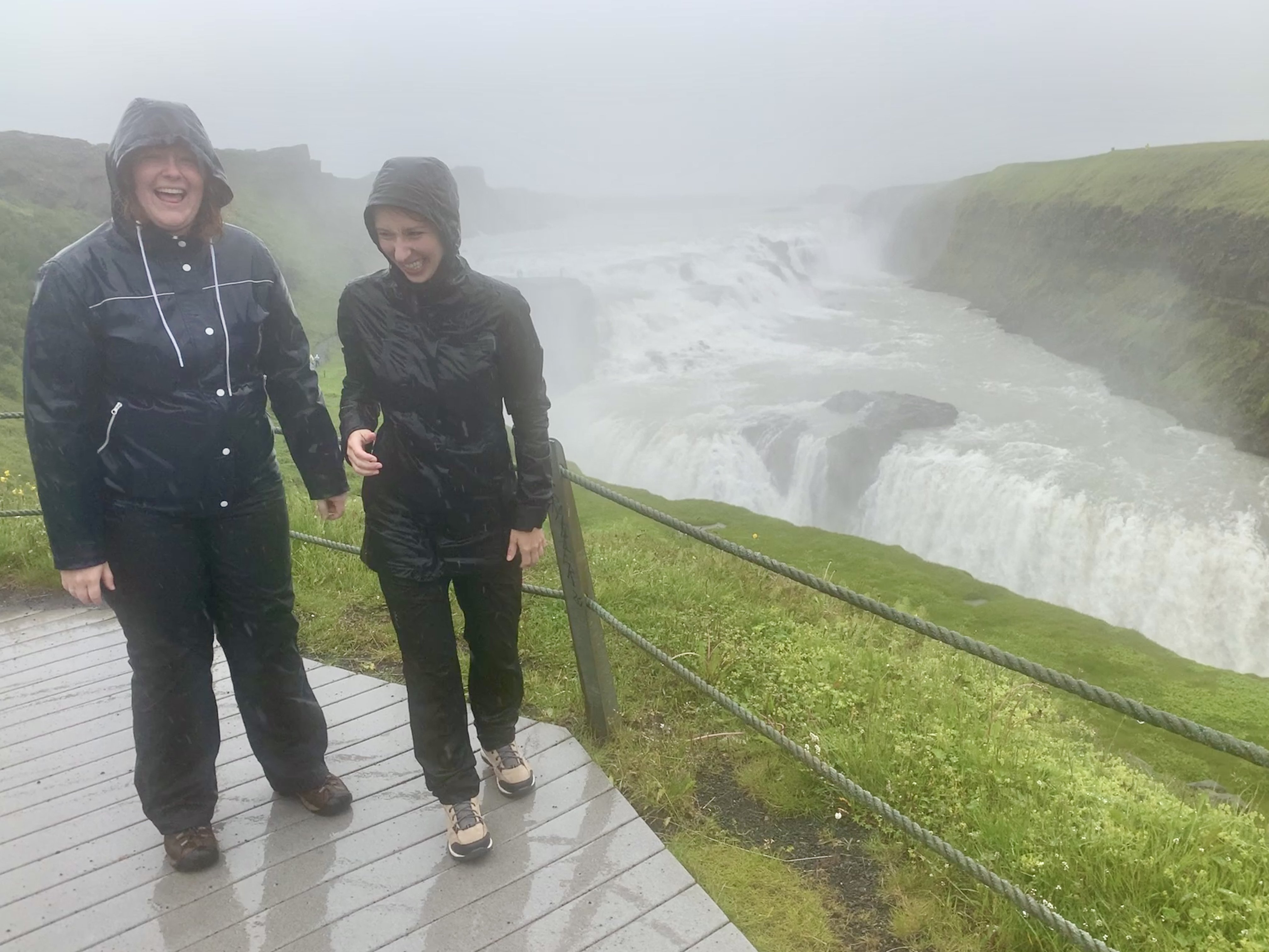 Merisa & Amanda soaked in mist with their hoods on after visiting Gullfoss