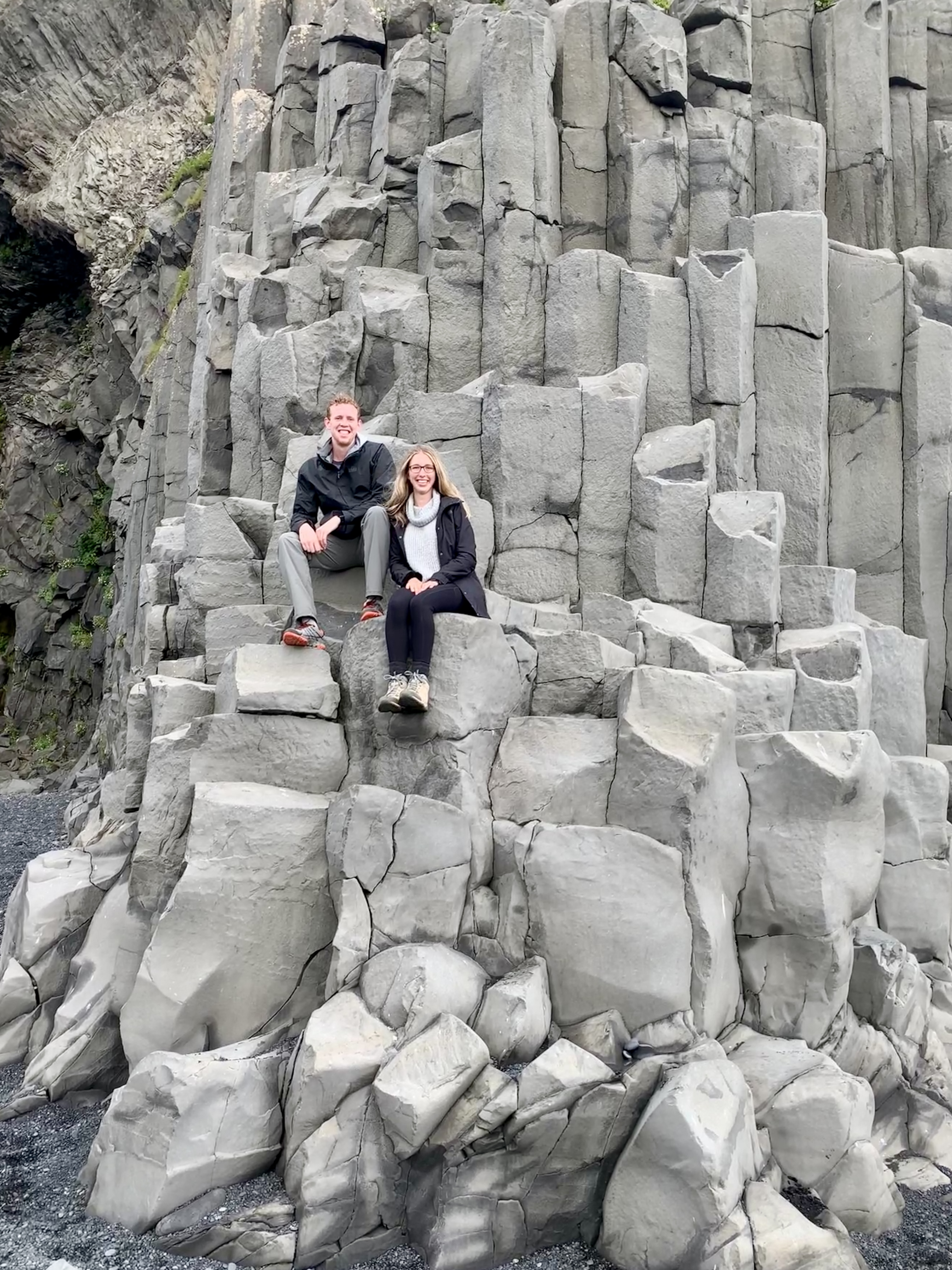 Mark and Amanda sitting on basalt columns